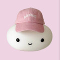 Pink cap with 'DIFFICULT' text on a white background
